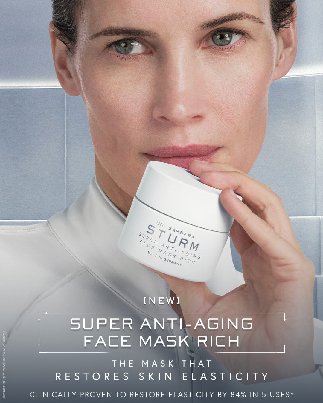 Woman holding a skincare product, promoting anti-aging face mask benefits.