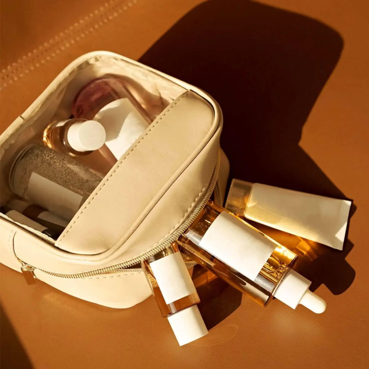 Generic skincare products spilling from makeup bag