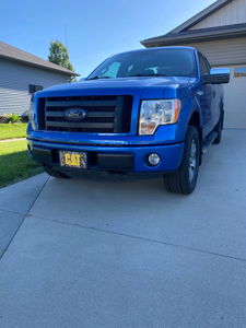 Blue Ford F-150 front exterior view