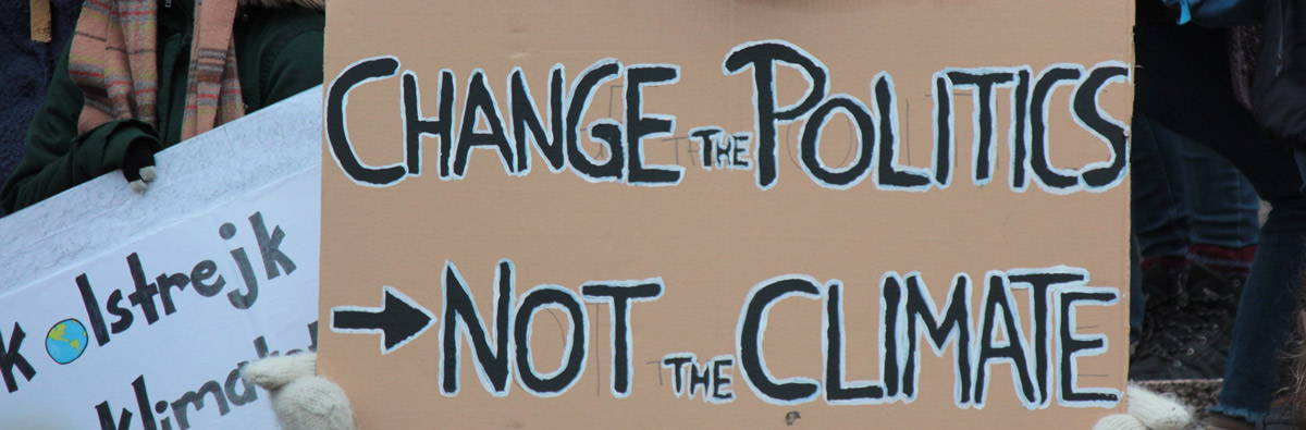 Change the politics not the climate protest sign