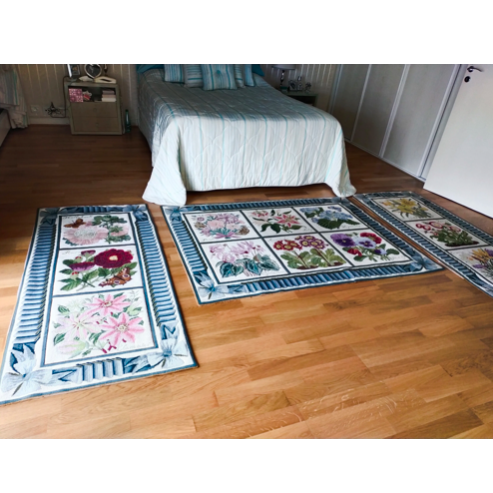 Three Needlework Carpets Floral Design