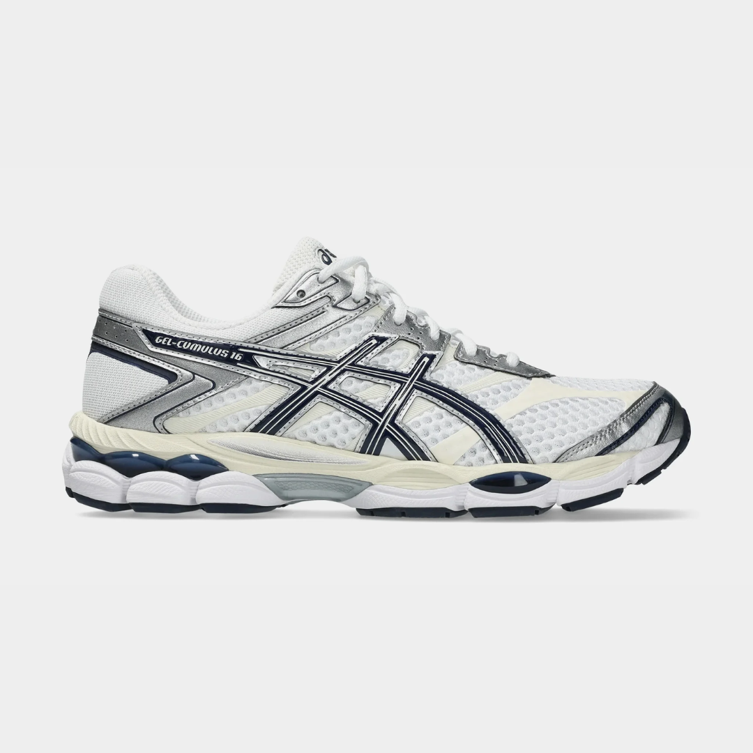 White and navy athletic shoes with a sleek design and cushioning.