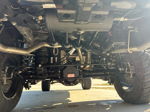 Close-up of train horn kit with air tank mounted above Mag-Hytec differential on lifted Ram