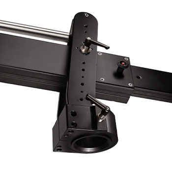Close-up of a mechanical component on a linear rail system.
