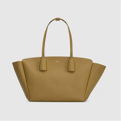A mustard yellow leather tote bag with two handles.