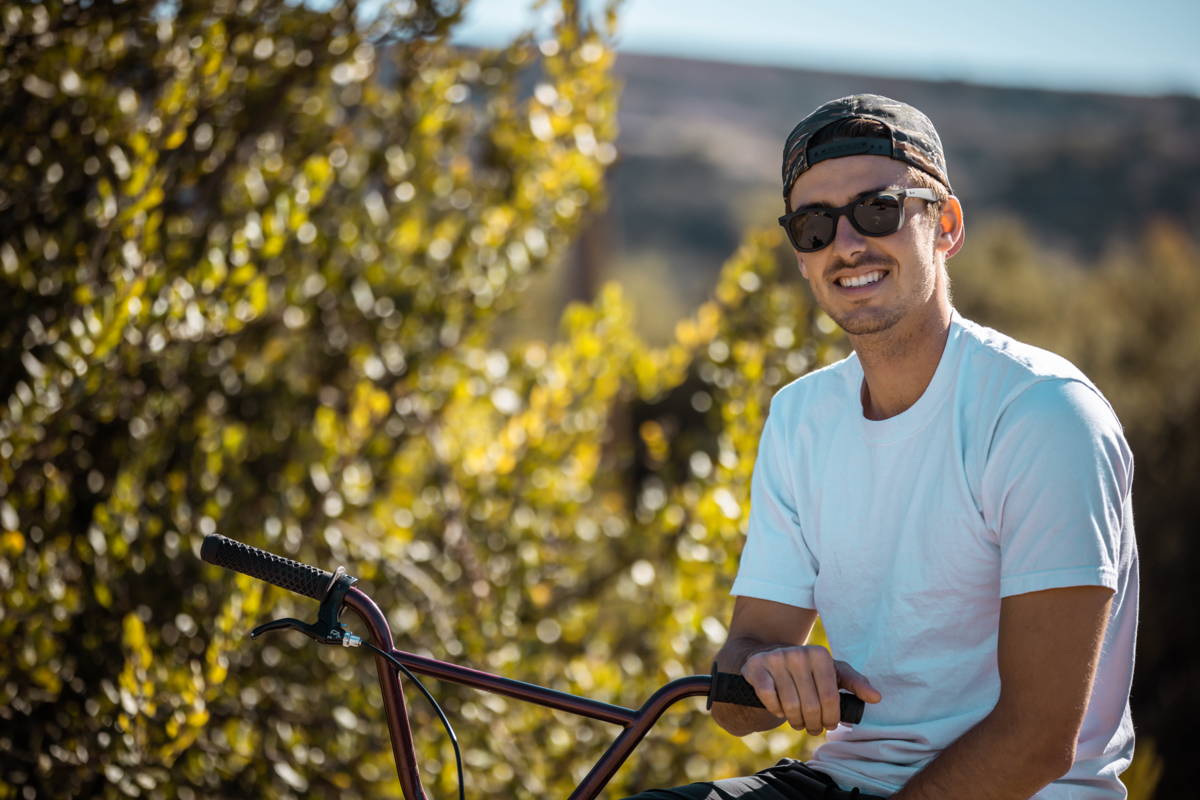 Man on a bike wearing gray sunglasses