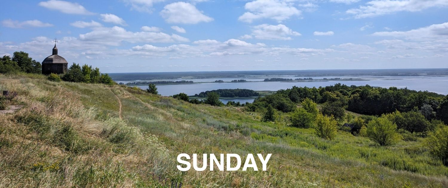 A scenic view of hills and water with the text 