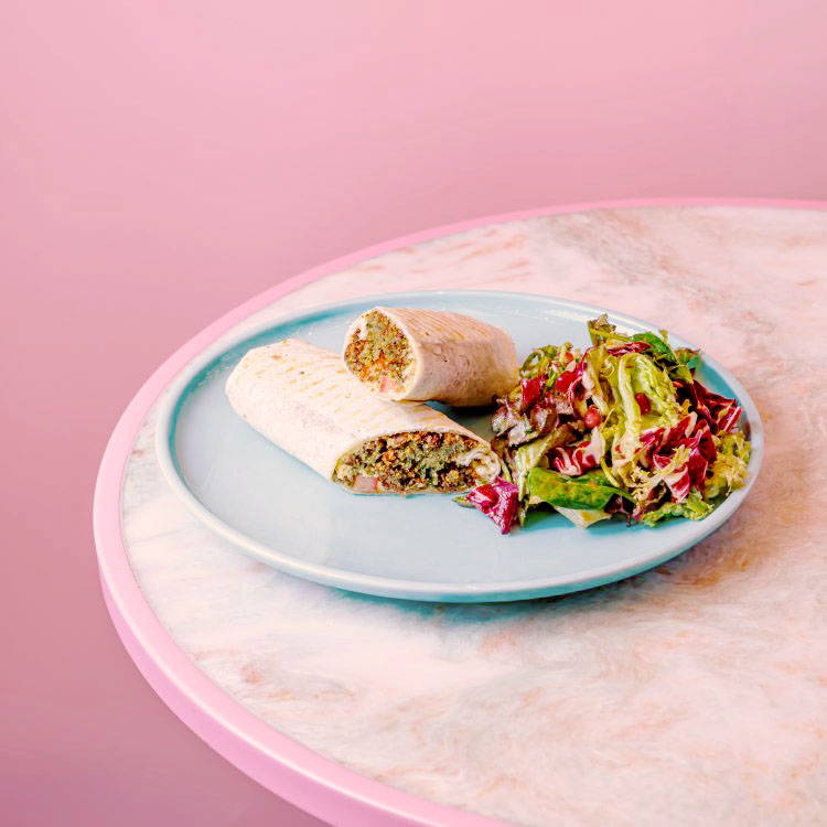 Falafel Wrap on pink marble table