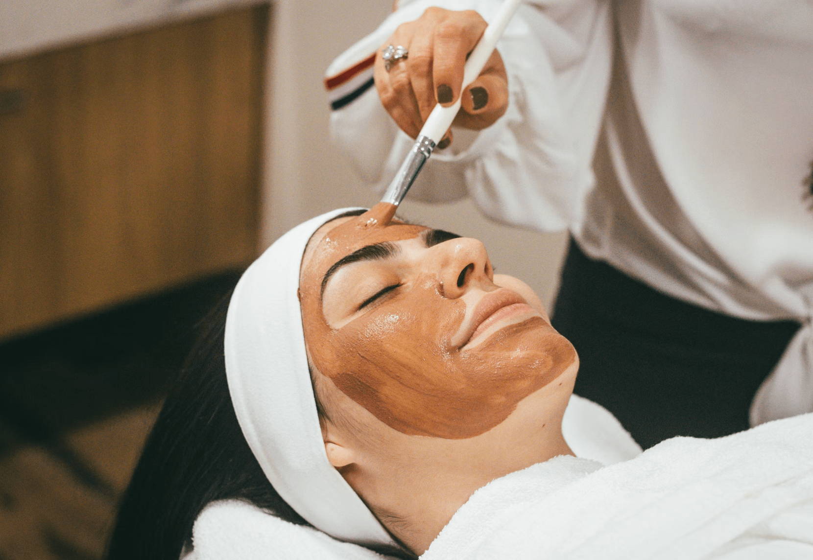 woman getting a face mask