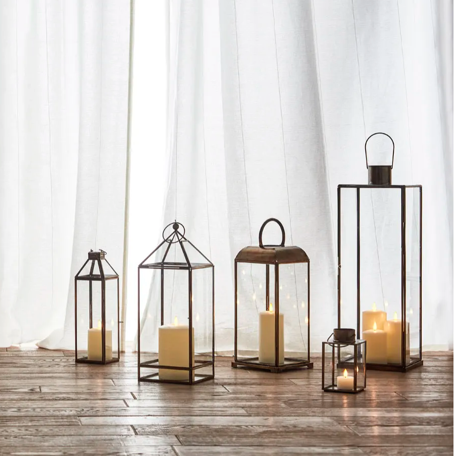 collection of large wedding lanterns placed on the floor