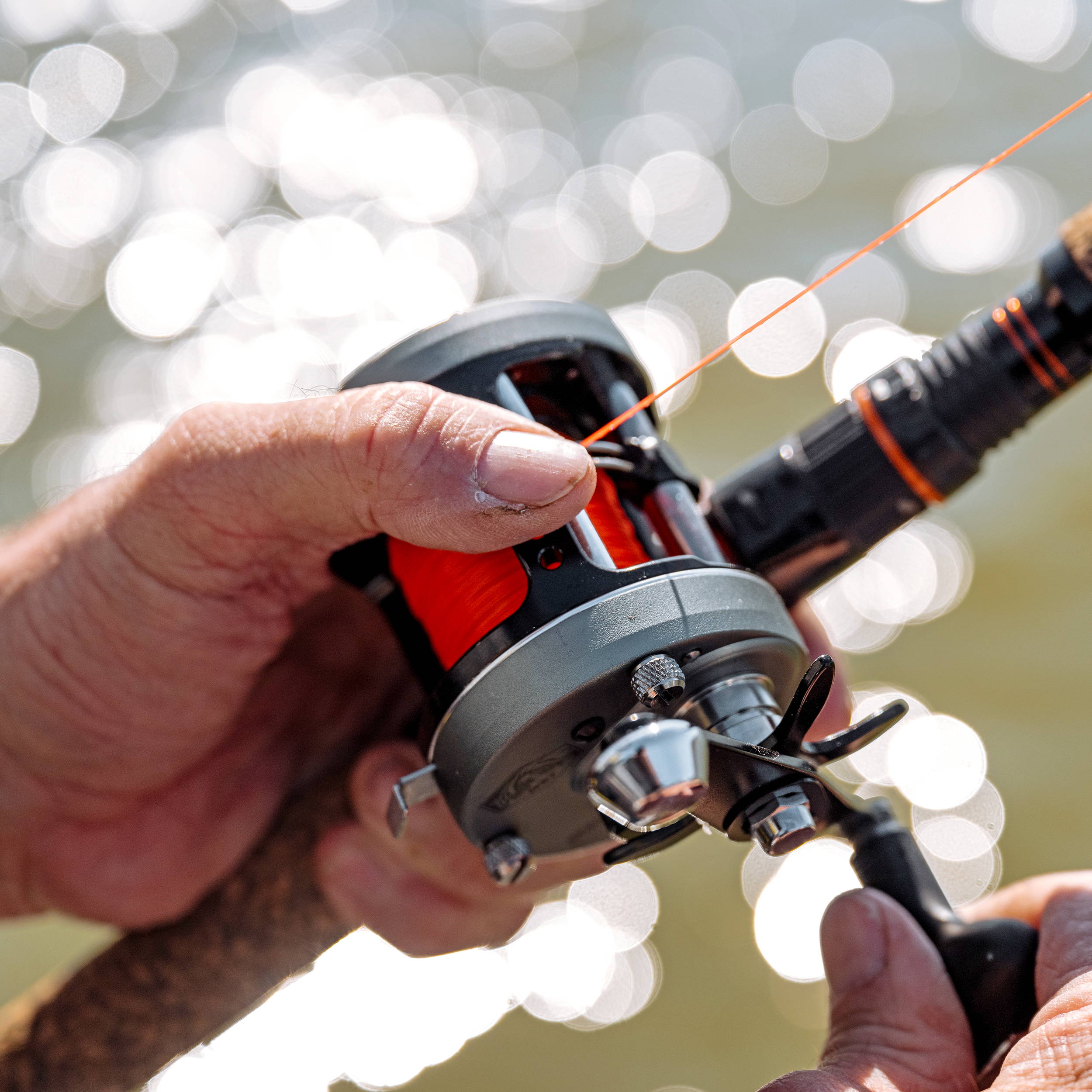 Close-up of the Seeker 60 Pro baitcast reel in use.