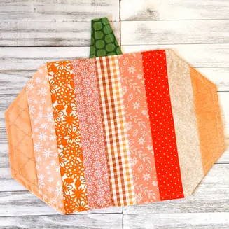 Scrappy pumpkin placemat sewing project.