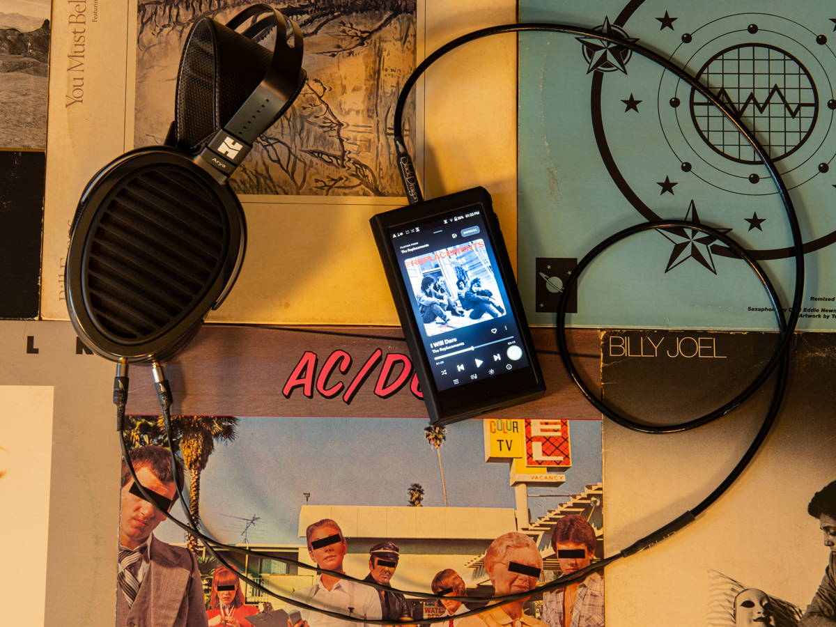 HiFiMan Arya Stealth with Black Dragon cable and Astell&Kern SP2000T DAP on a pile of record albums