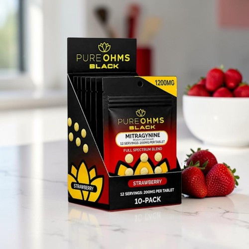 Box of Pure Ohms Black dietary supplements with strawberries in the background.