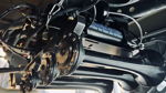 Close-up glossy black train horns HornBlasters logo compressor air lines zip ties mounting brackets Stephen's 2020 Tundra 244 Spare Tire Delete gallery photo 2