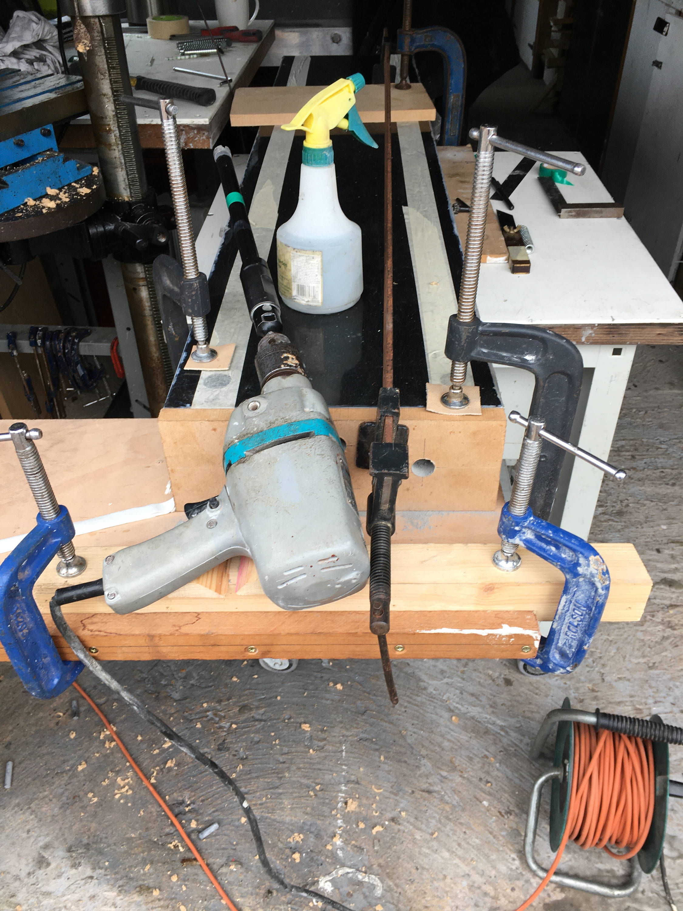 Photograph showing the full jig setup for drilling the granite insert holes.