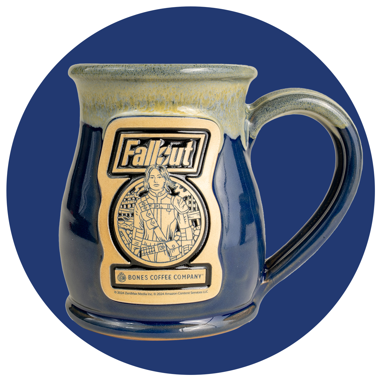 The front of the Bones Coffee Company Lucy hand thrown mug with the Atomic Apple art on the golden medallion. It is inspired by Zenimax and Amazon’s Fallout show. The mug is powder blue colored with a white and yellow glaze on top. A dark blue circle is behind it.