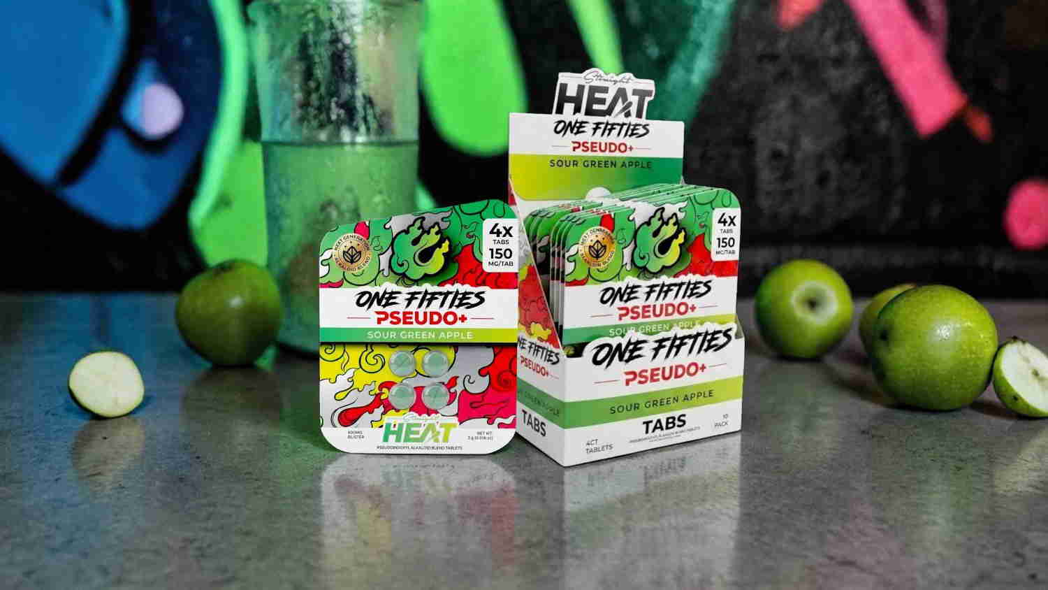 Colorful boxes of candy with limes on a textured surface.