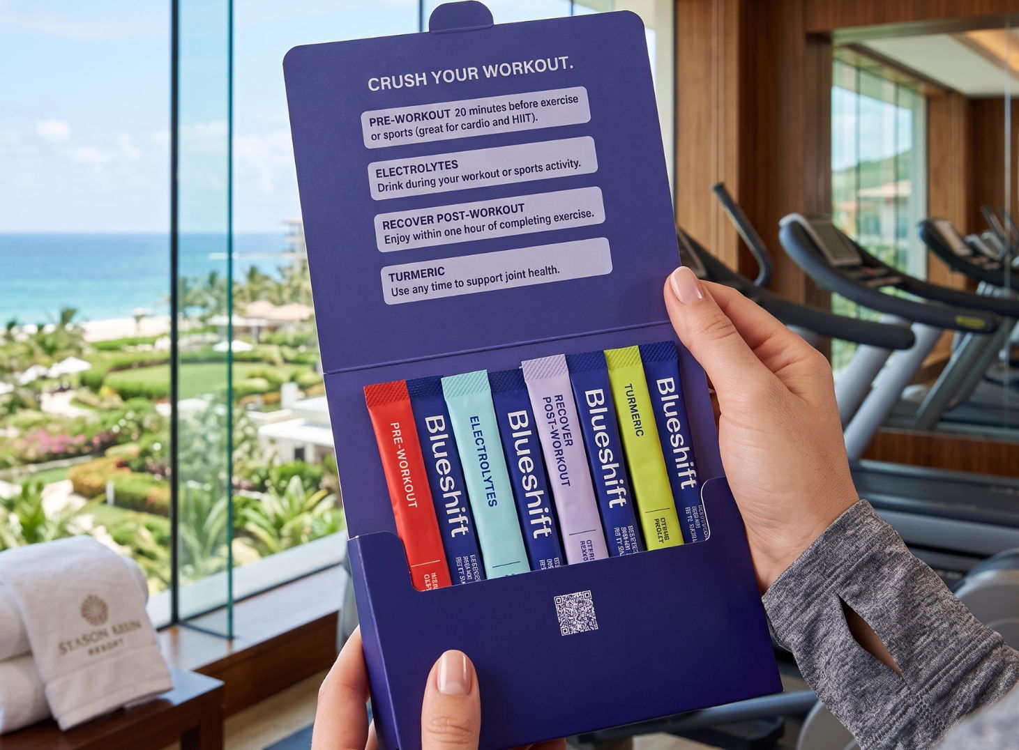Zoomed in shot of someone holding Workout Essentials kit in a fitness center