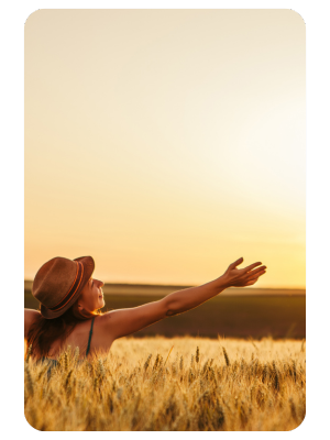 natural remedies blog image of woman standing in fielding happy