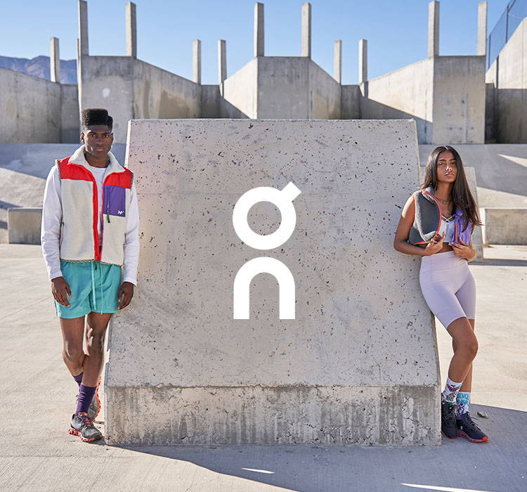 male and female model wearing on running shoes