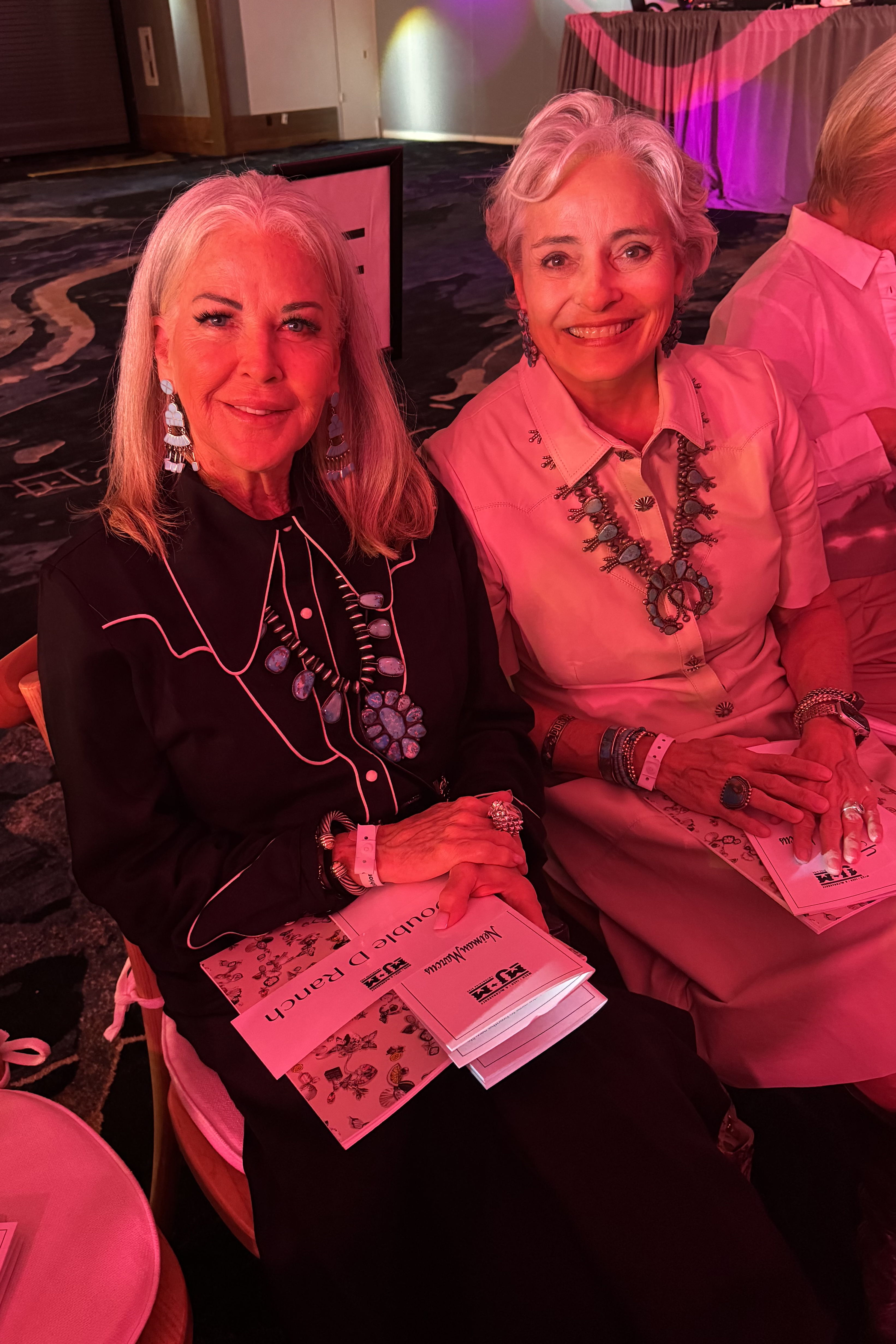 Kathleen Burnham and Hedy Carter attending the MJ&M Fashion Show.