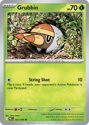 A Grubbin Pokémon card with a grassy background and attack details.