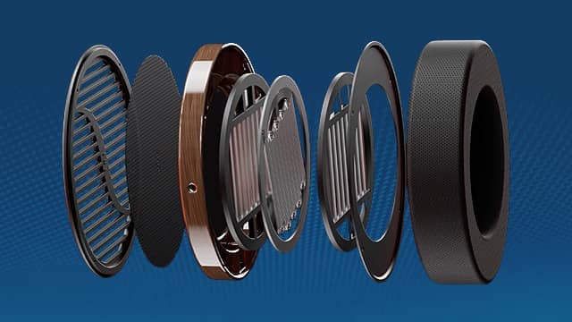 Exploded view of a planar magnetic headphone with multiple layers and parts.