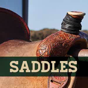 Up close picture of tooled western saddle with dally wrap wrapped around the saddle horn