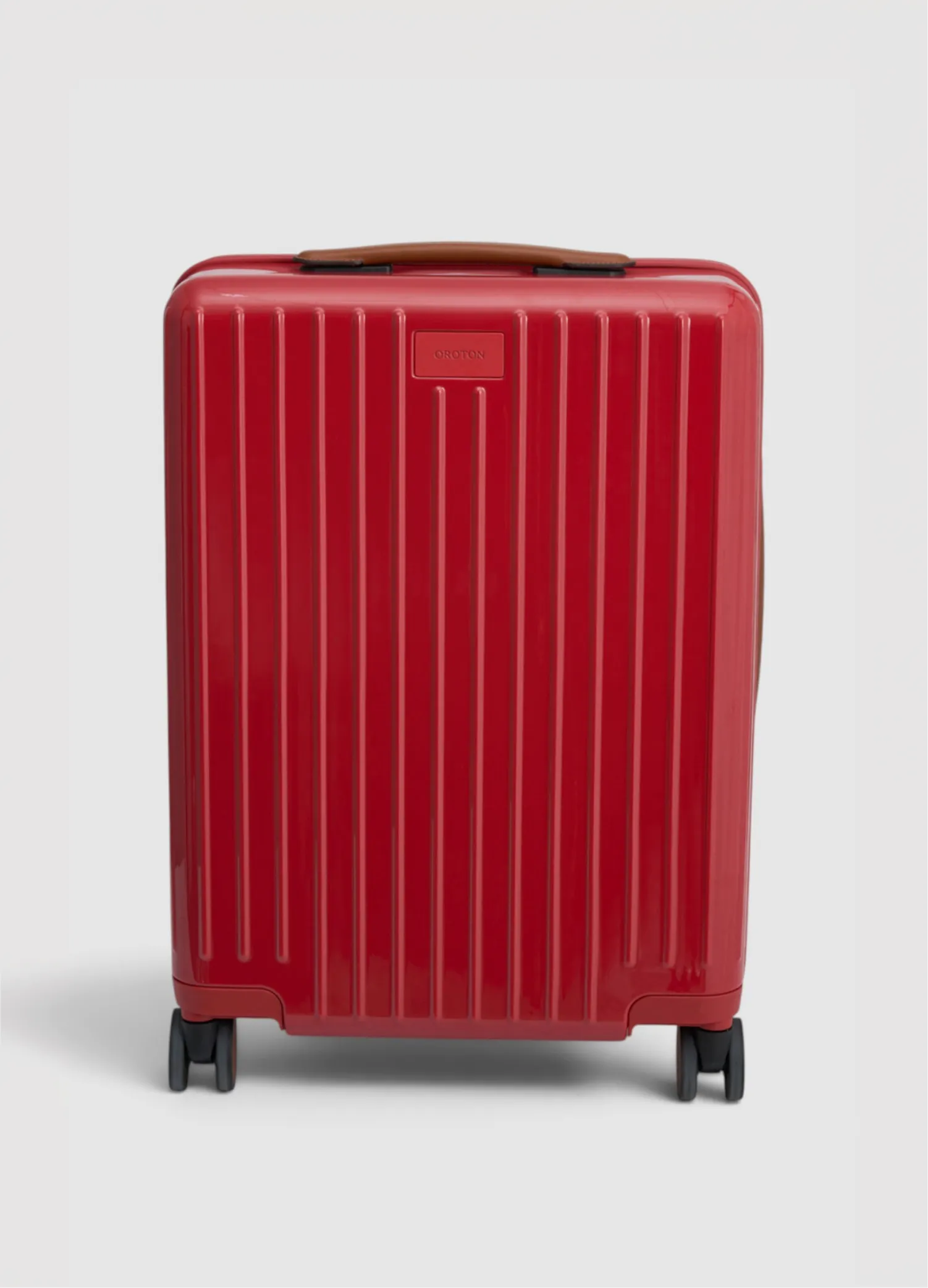 Red suitcase with vertical stripes and wheels.