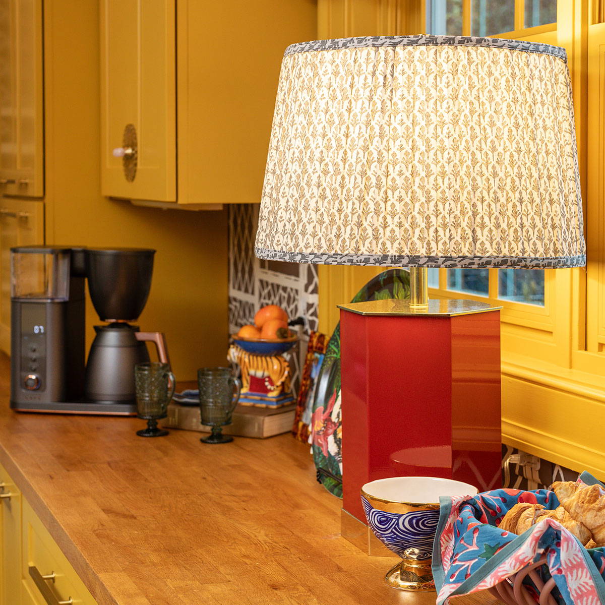 Custom fabric lampshade with coffee maker in background