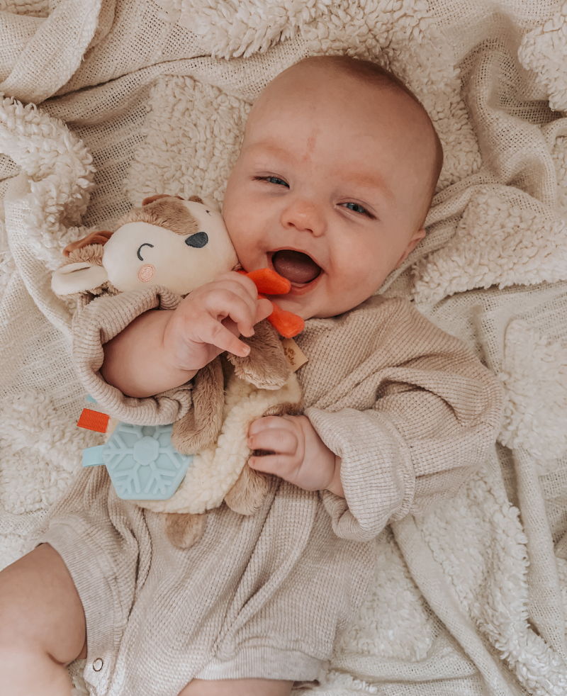 Baby with lovey plush toy