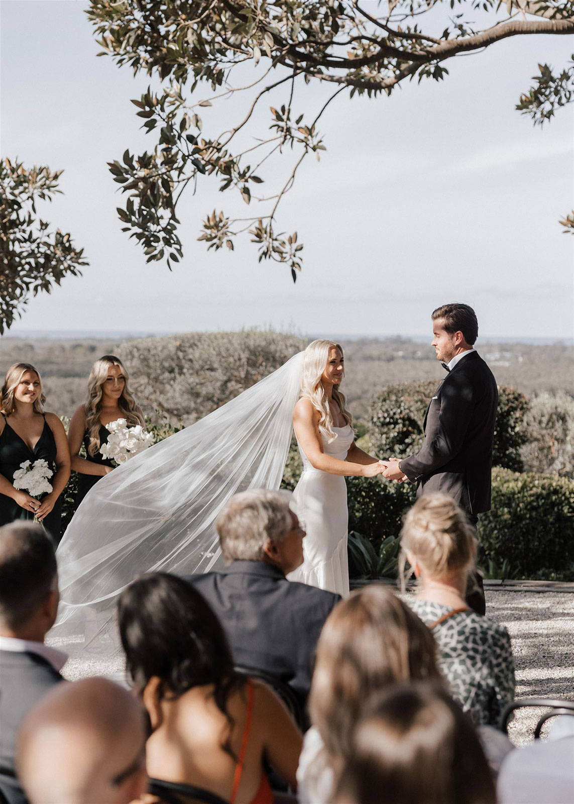 Bride and groom holding hands at wedding ceremony