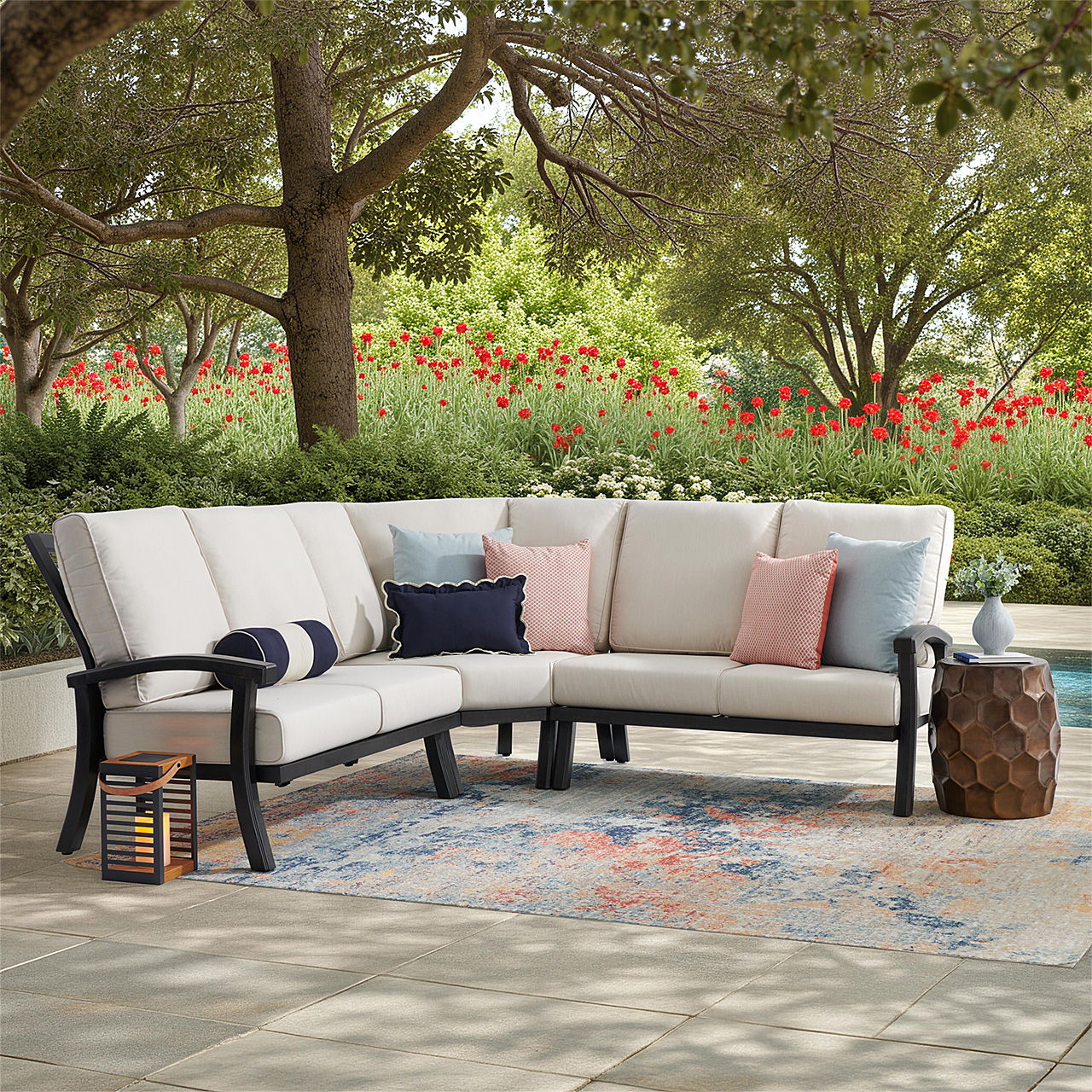 Outdoor seating area with a sectional sofa and decorative pillows.
