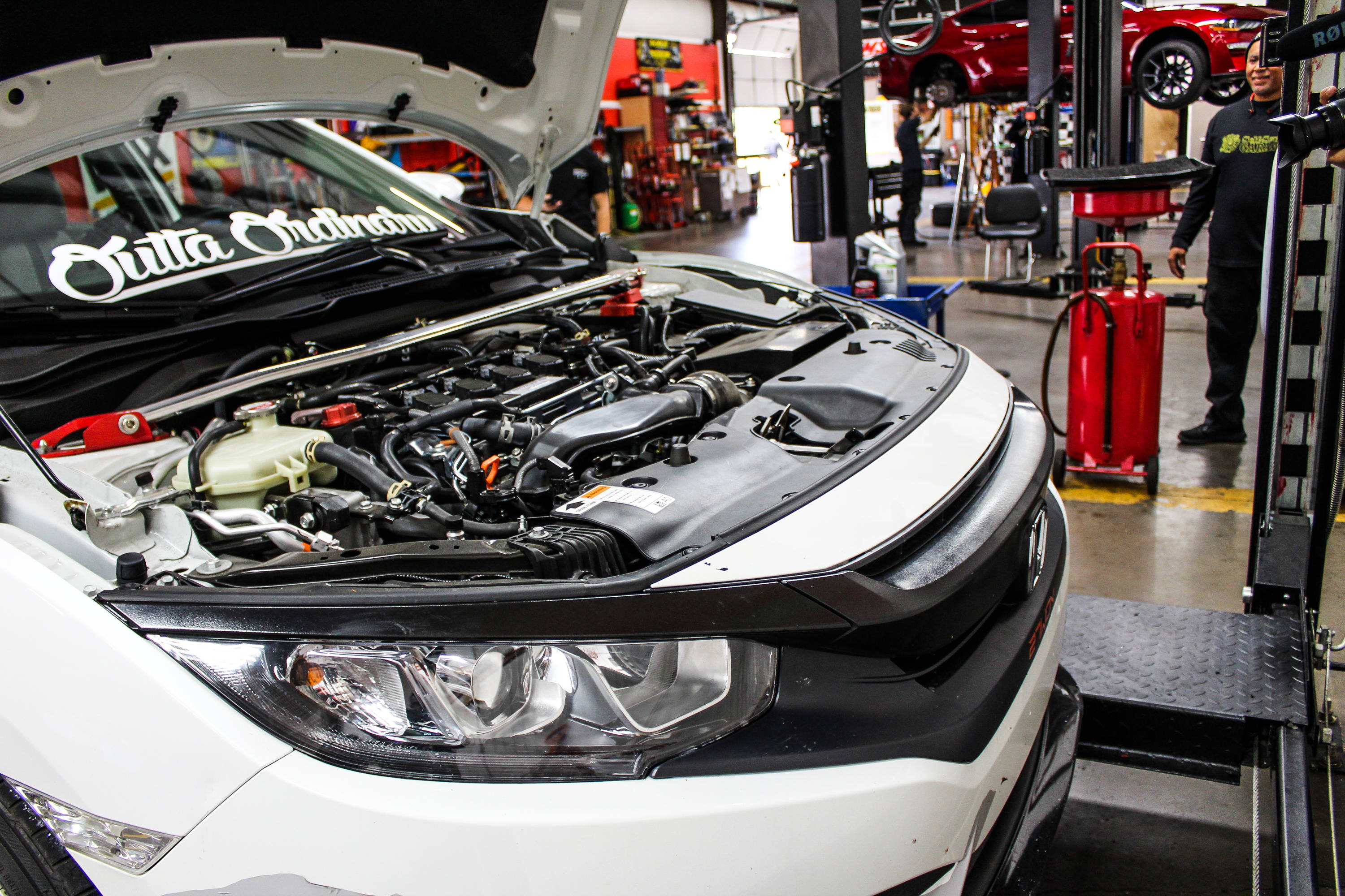 2017 Honda Civic - Opening hood and removing oil cap.