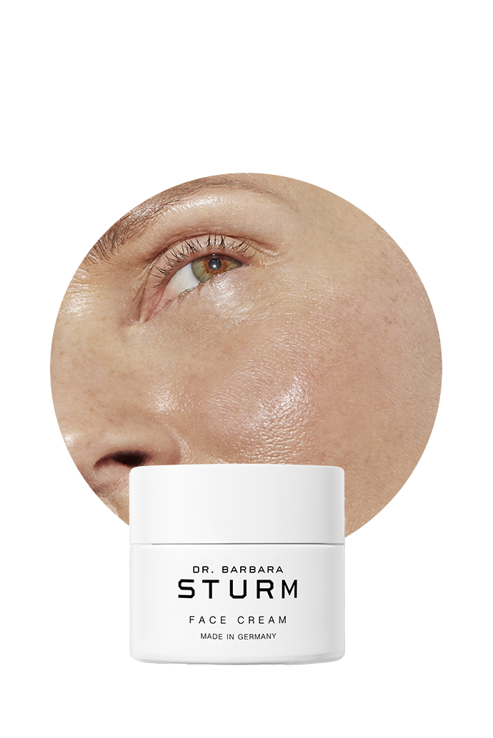 A close-up of a face with skincare cream.
