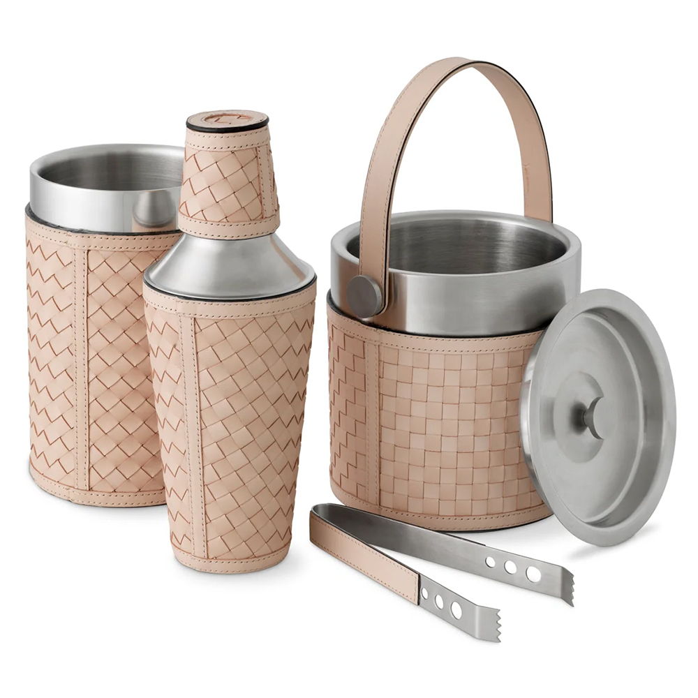 A cocktail shaker set with woven texture and stainless steel accents.
