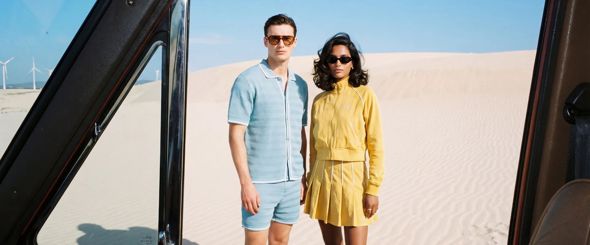 A Desert State of Mind - A man and woman stand together on a sandy beach.