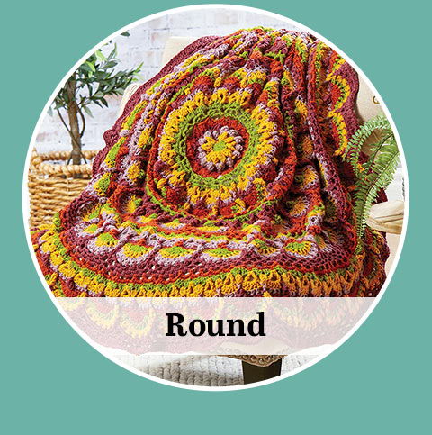 Colorful round crochet blanket displayed on a chair. with the word 