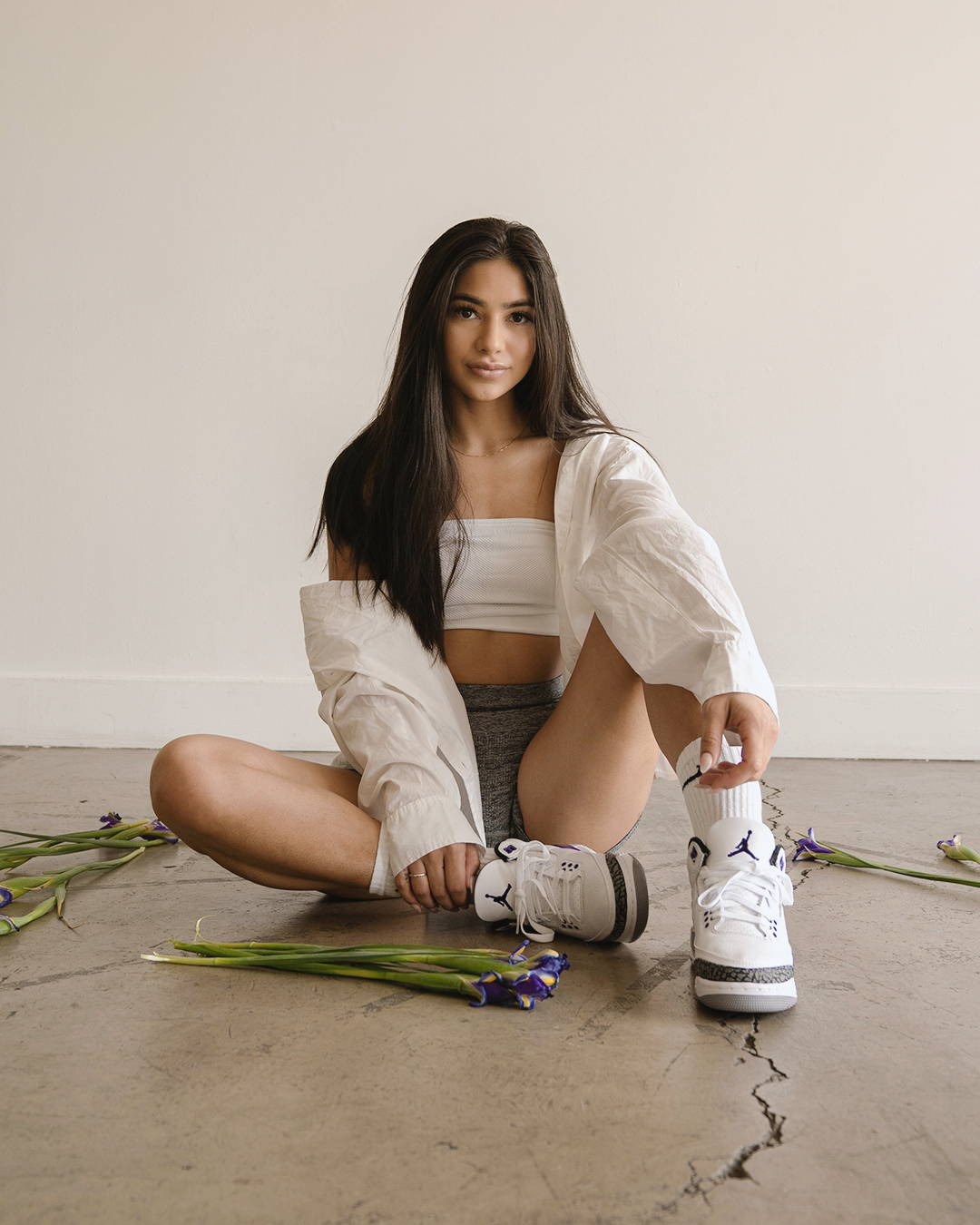 female model in aj3 dark iris sitting