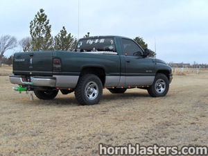 Rear three-quarter view of the 1998 Dodge Ram 1500 with Fly-N-Hi decal and underbody lighting