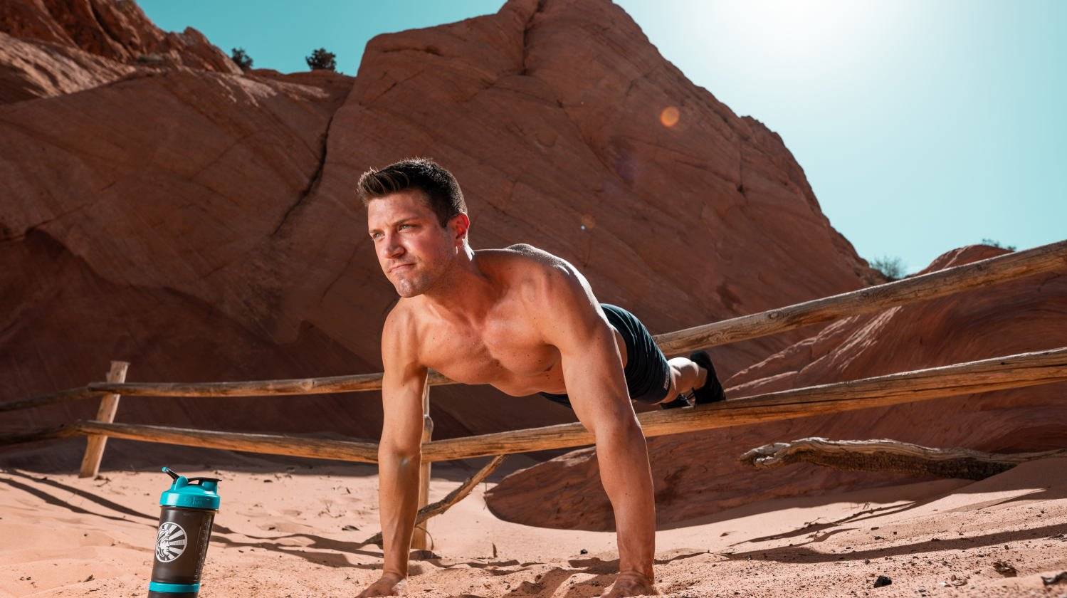 Ambassador Tommy Didario doing push up with feet elevated in the desert | The Best Protein Powder for Men | best protein powder for men weight loss | Featured