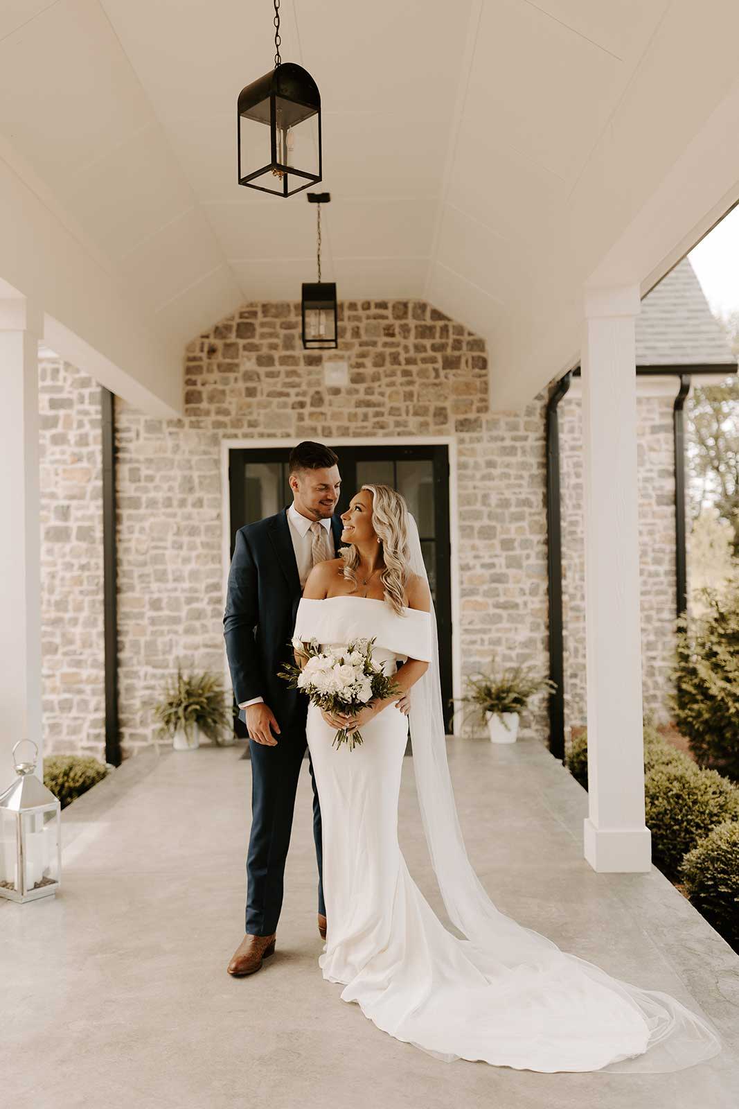 Bride and groom outside of chapel