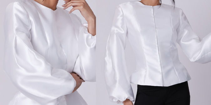White blouse with puffed sleeves, worn by a model.