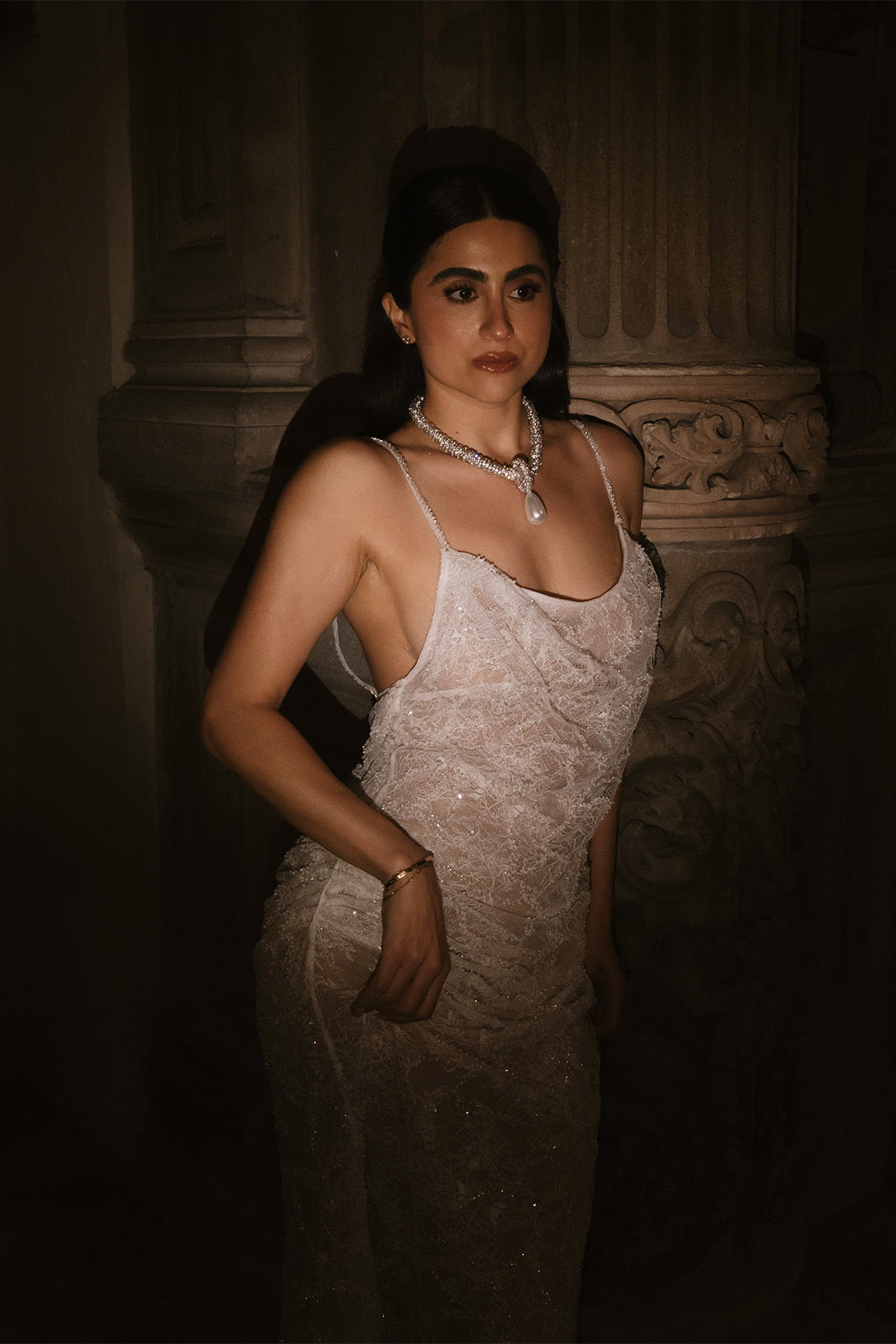 Bride in her second look featuring sheer lace fabric with sequins