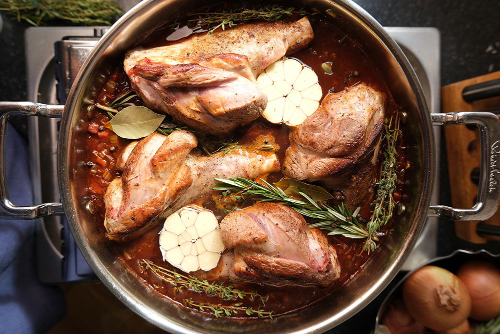 316 Series Low Casserole with lab shanks, herbs and garlic.