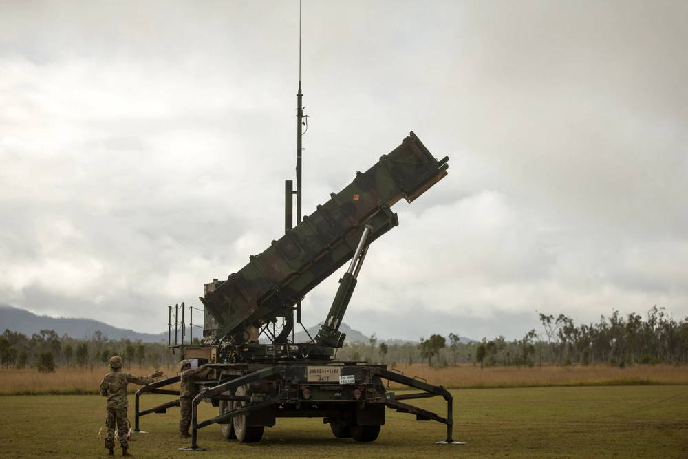 U.S. Army Sgt. Tamayo Ezekiel (right) and U.S. Army Pfc. Colby McCormick (left), Army Patriot Launching Station Enhanced Operators, raise the MIM-104 Patriot launching station Jul. 14, 2021, at Camp Growl in Queensland, Australia, during Exercise Talisman Sabre 2021. TS 21 supports the U.S. National Defense Strategy by enhancing our ability to protect the homeland and provide combat-credible forces to address the full range of potential security concerns in the Indo-Pacific. Ezekiel is a native of Anchorage, Alaska. McCormick is a native of Roanoke, Alabama. (U.S. Marine Corps photo by Lance Cpl. Alyssa Chuluda)