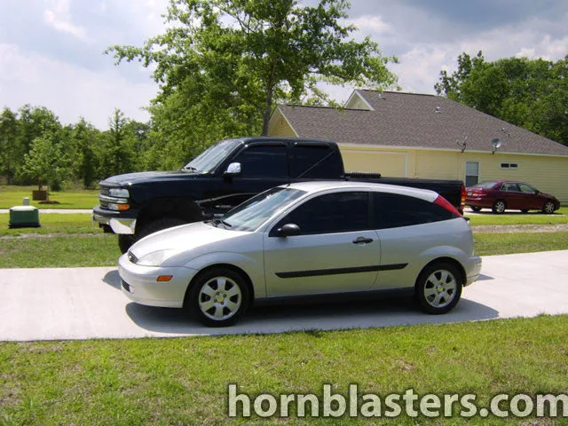 Side profile of Layne's 2002 Ford Focus with Shocker XL train horn install HornBlasters gallery photo 2