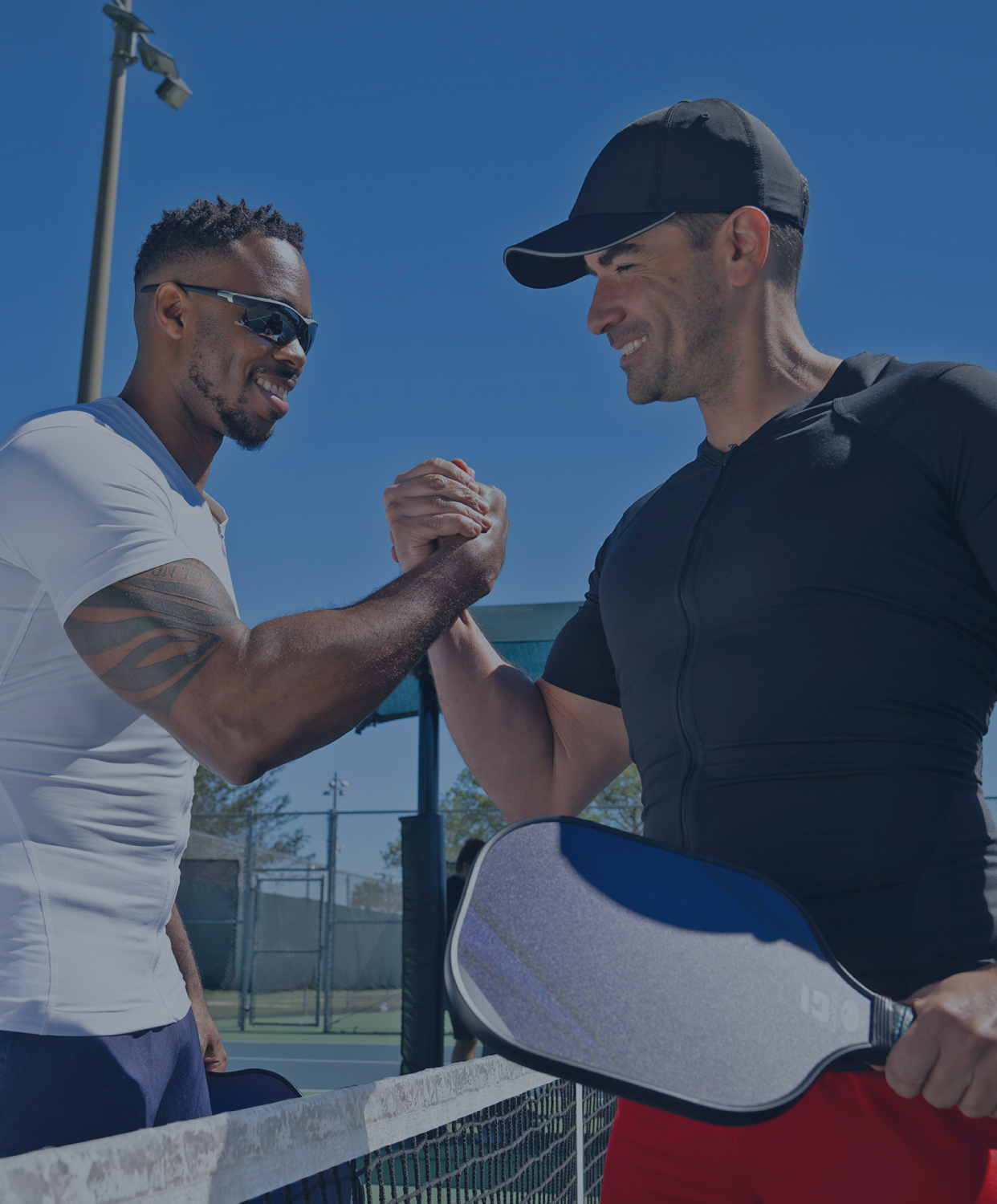 Two men getting ready to play pickleball in Full Back Support Shirts