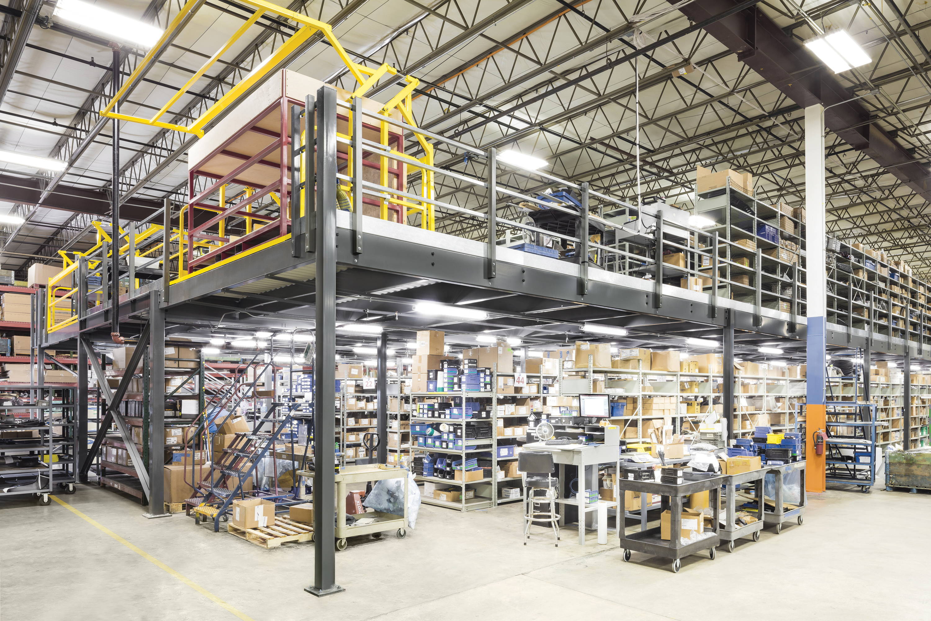 Large warehouse mezzanine with rotating mezzanine gate installed in Detroit warehouse.